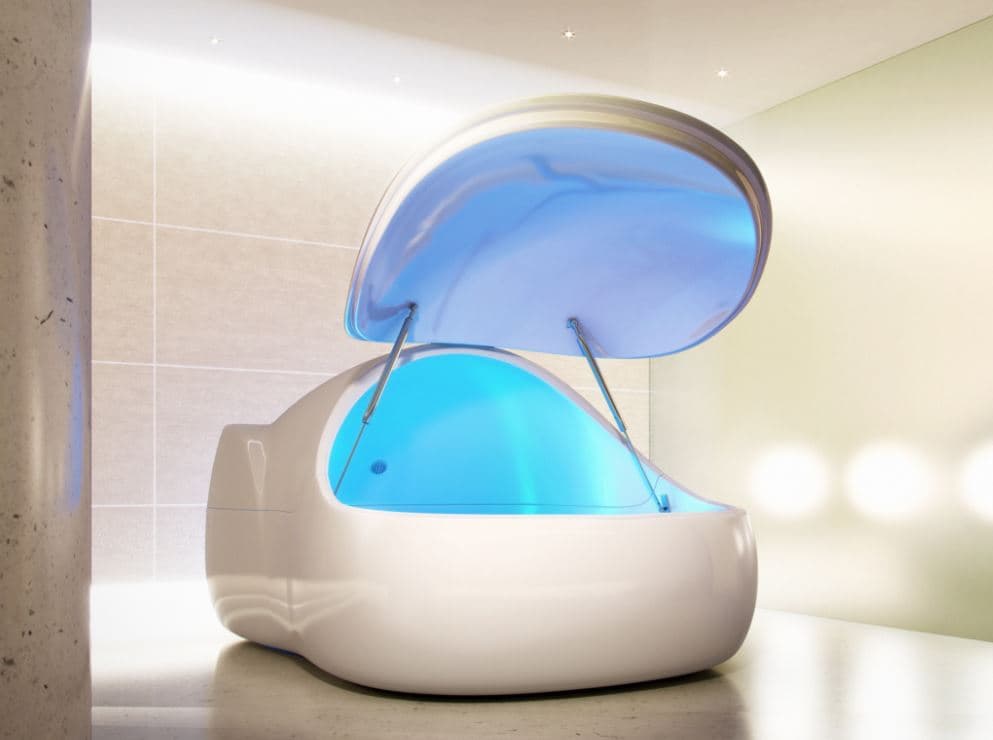 Modern flotation tank pod open in a spa room